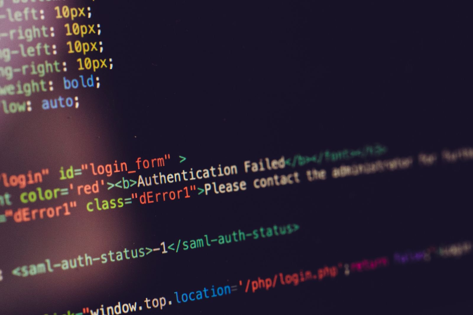 A computer screen displays HTML code alongside an authentication error message